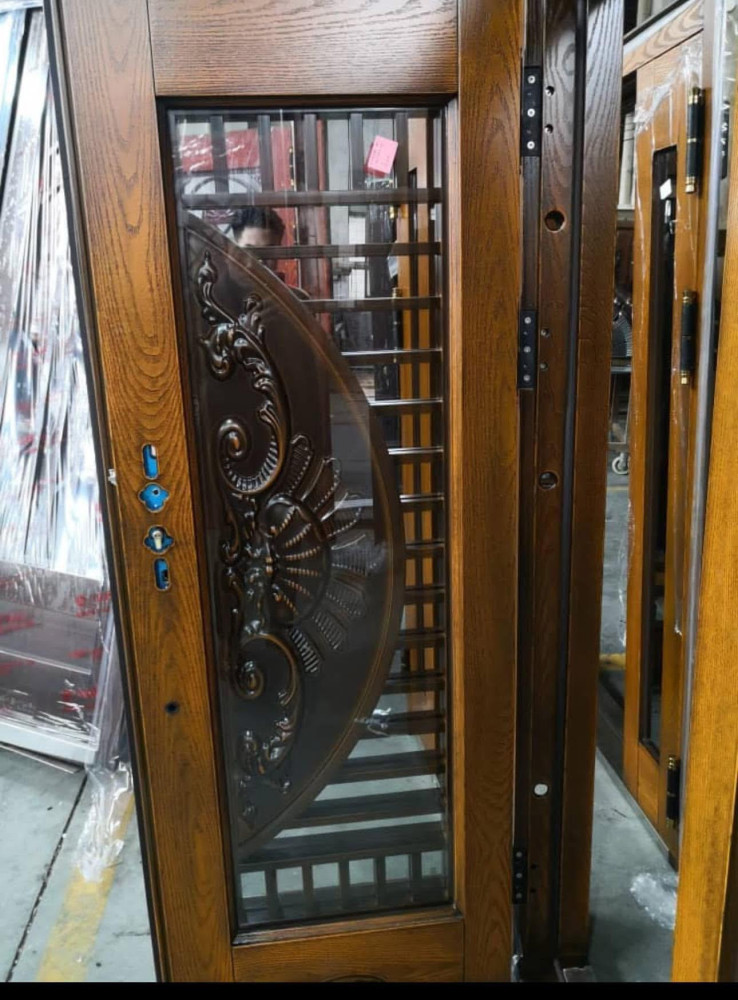 Ornate Steel Security Door with a wood-look finish