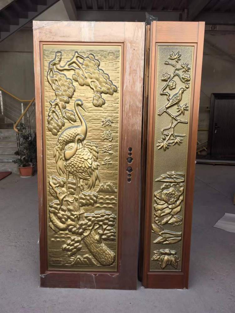 Ornate Security Door with detailed carvings and a brass finish