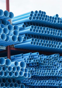 Stacks of blue Polyvinyl Chloride (PVC) pipes