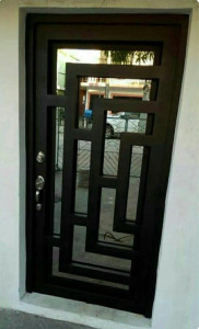Modern Metal and Glass entry door with an abstract geomtric design