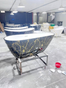 Freestanding Bathtu with a Black and gold marble Pattern
