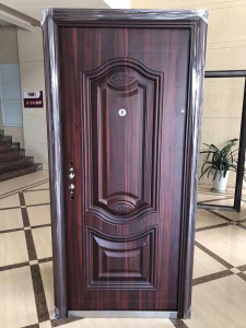 Steel Security Door with a dark wood grain finish