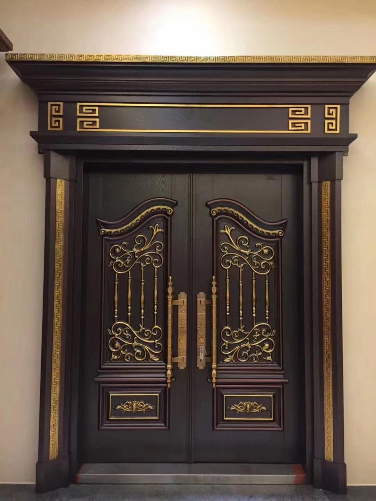 Luxury Executive Turkish Door potentially made of cast Aluminum or Steel zinc alloy with a dark finish and ornate gold-coloured
