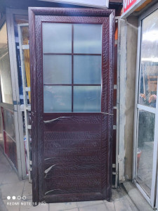 Brown Aluminum toilet door with wood-grain finish and frosted glass panels