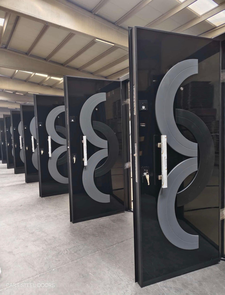 Black Security Doors with a Distinctive silver and black circular design
