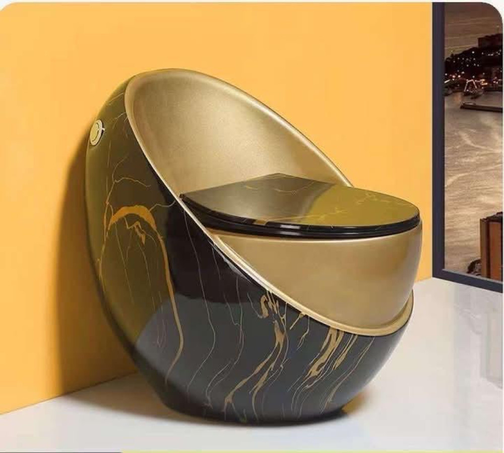 Egg-shaped smart toilet with a black marble grain and gold finish