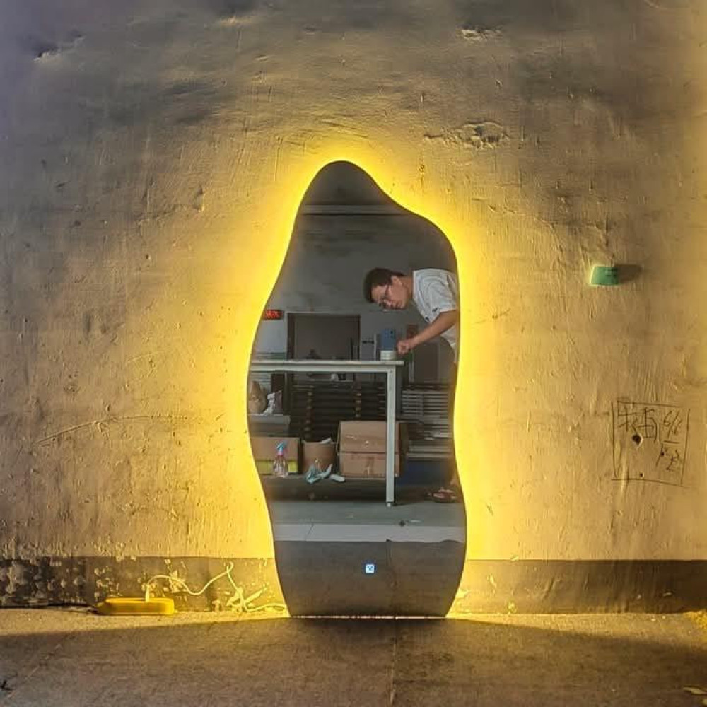 Contemporary amorphous Led wall mirror
