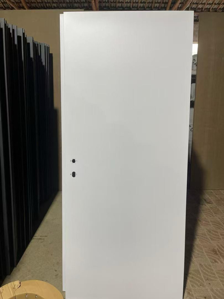 White, flush interior door with two pre-drilled holes for a handle set