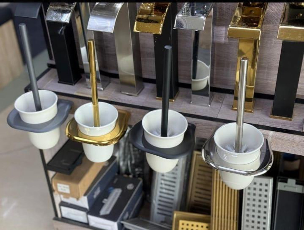wall-mounted toilet brushes and holders available in various finishes like gold, silver and black