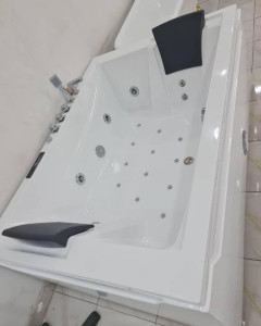 Acrylic White Whirlpool Bathtub possibly a two-person model
